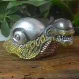 Evil mutant snail field ornament