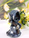 Hooded black doll statue - standing style