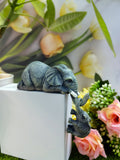 A pair of elephant resin garden ornaments