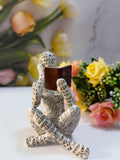 Contemplative reader male resin ornament