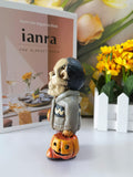 The skeleton man with the pumpkin resin ornaments