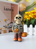 The skeleton man with the pumpkin resin ornaments