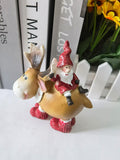 Santa Claus resin ornament with moose