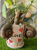 Garden snail resin ornament