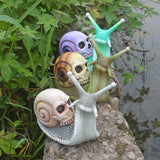 Halloween skeleton snail skull sculpture