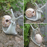 Halloween skeleton snail skull sculpture