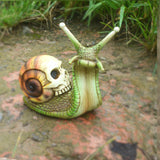 Halloween skeleton snail skull sculpture