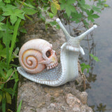 Halloween skeleton snail skull sculpture